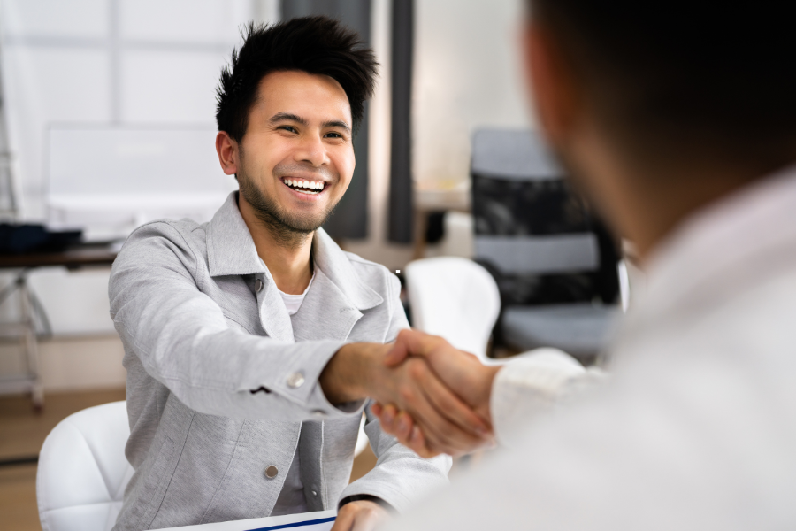 Two people shaking hands.